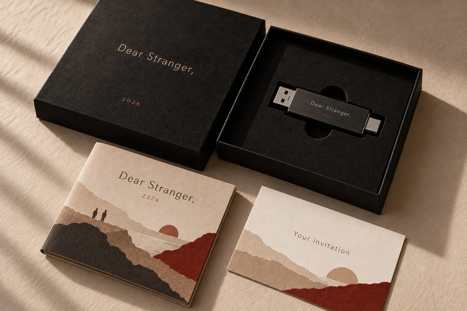 Dear Stranger, 2026 box with a USB-A and USB-C drive, an illustrated booklet and invitation card